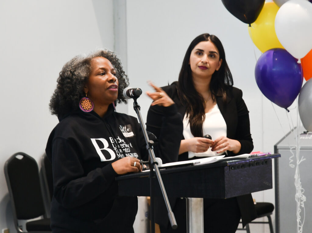 Heather Hines and Sonia Kang at the podium